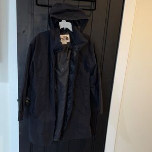 The North Face black hooded rain coat